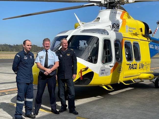 Queensland Police Acting Chief Superintendent Andrew Pilotto with QG Air's Darren O'Brien and Patrick Gillespie. Picture: Matt Johnston