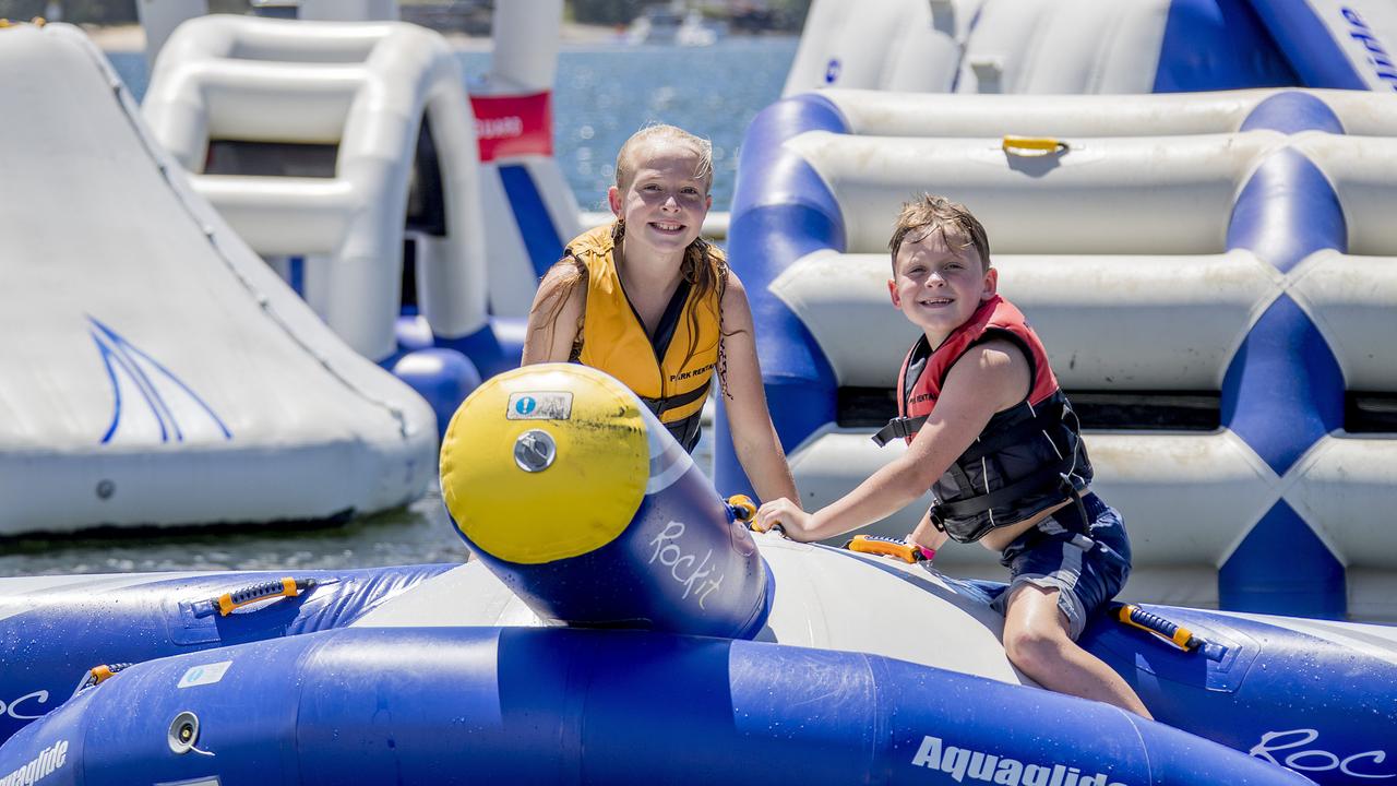 Matilda Channells, 11, and Darcy Channells, 7, at GC Aqua Park, Southport. Picture: Jerad Williams