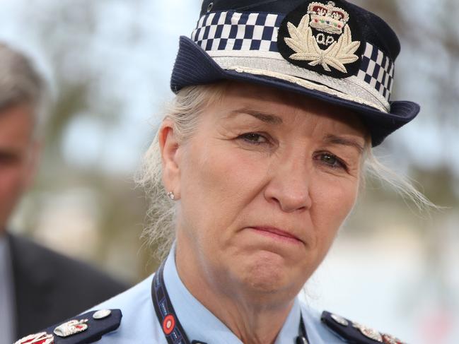 Police Commissioner Katarina Carroll talk in front of floral tributes placed at the memorial area for the helicopter crash victims, at Broadwater Parklands opposite Seaworld. Picture Glenn Hampson