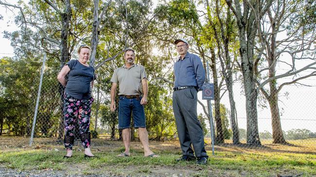 Neighbouring residents Jennifer Matton and Andrew Scott join B4C catchment manager Wayne Cameron at the Fursden Rd site last year to raise concerns about the development. AAP/Richard Walker