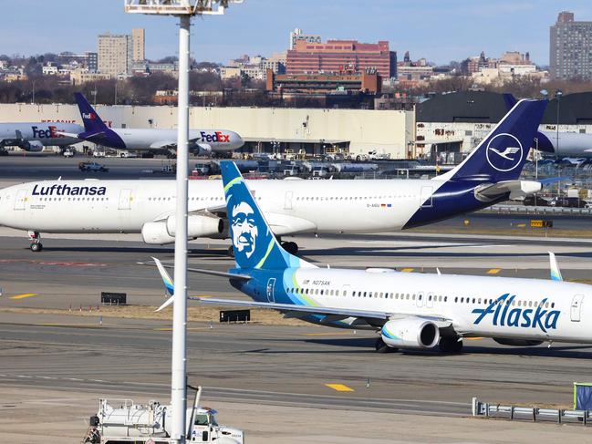 A Boeing 737-900er passengers aircraft of Alaska Airlines on its way to San Francisco is seen before take-off at John F. Kennedy Airport on January 8, 2024. Shares of Boeing plunged early Monday after an airplane panel blew out mid-flight, reviving safety questions at a time when the company hoped to recover its reputation. (Photo by Charly TRIBALLEAU / AFP)