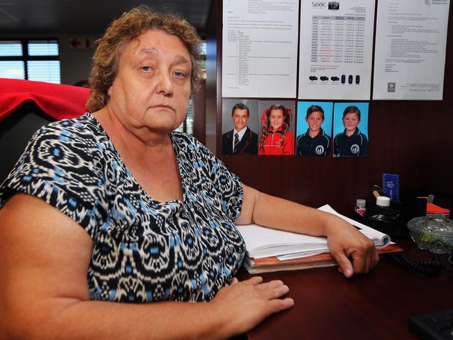 Hilda van der Merwe, 56, has photos of four of her six grandchildren on the wall of her workstation in South Africa. They now live in Perth.