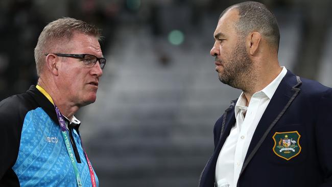 SAPPORO, JAPAN - SEPTEMBER 21: Michael Cheika (R) of Australia and John McKee (L) of Fiji talk prior to the Rugby World Cup 2019 Group D game between Australia and Fiji at Sapporo Dome on September 21, 2019 in Sapporo, Hokkaido, Japan. (Photo by Dan Mullan/Getty Images)