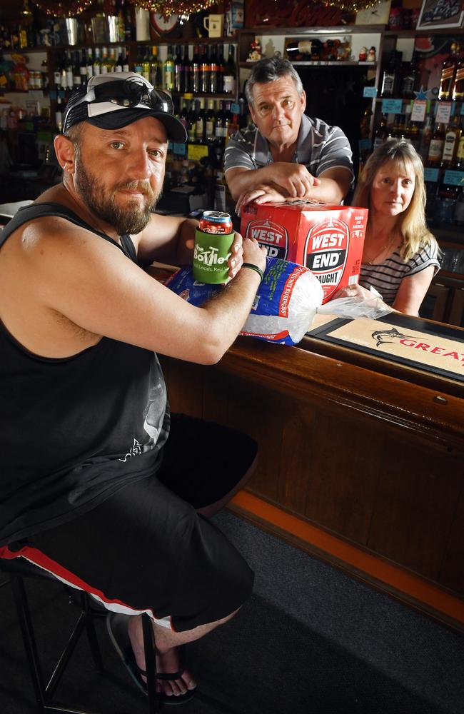 STOCKING UP: Steven Bennett with Gilbert Valley Hotel publicans Brian and Linnette Latimer. Picture: Tom Huntey