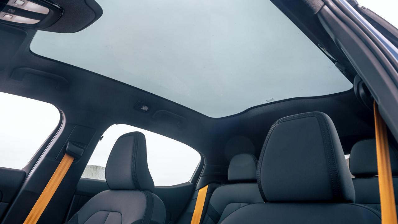 Option packs in the Polestar 2 include yellow seatbelts and a panoramic sunroof.