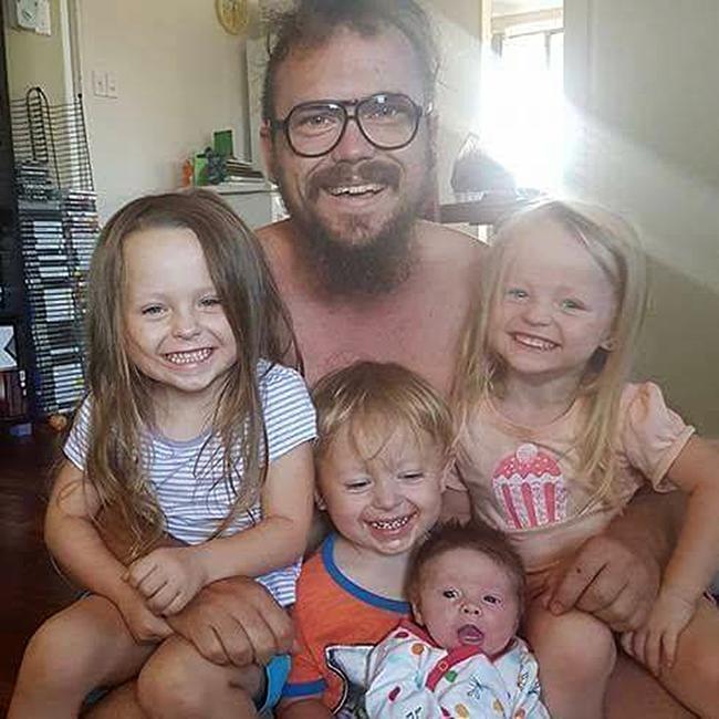 James McLeod poses with his children in this picture from Facebook.