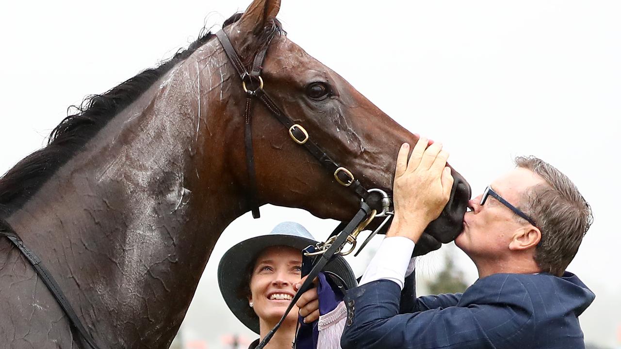 Trainer David Vandyke plants a kiss on Alligator Blood after his gutsy win. Picture: Getty Images