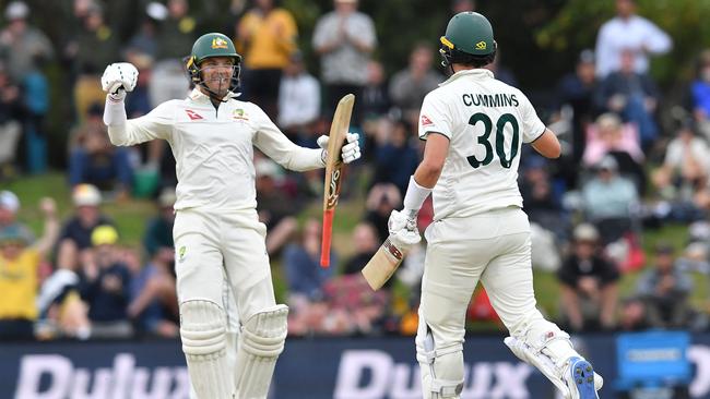 Alex Carey and Pat Cummins celebrate victory in Christchurch. Picture: Sanka Vidanagama / AFP