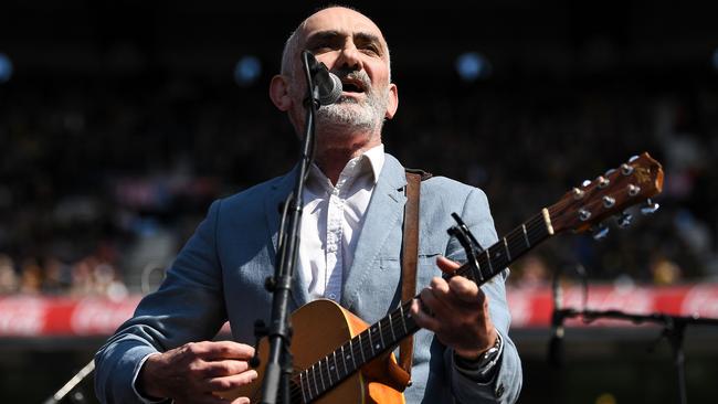 Paul Kelly sings during the 2019 AFL Grand Final at the Melbourne Cricket Ground. Picture: Daniel Carson/AFL Photos via Getty Images