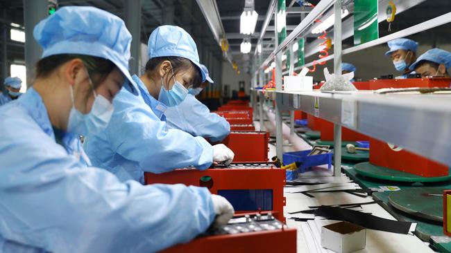 Employees at work in a lithium battery manufacturing company in Huaibei, eastern China's Anhui province, in 2020. Picture: AFP