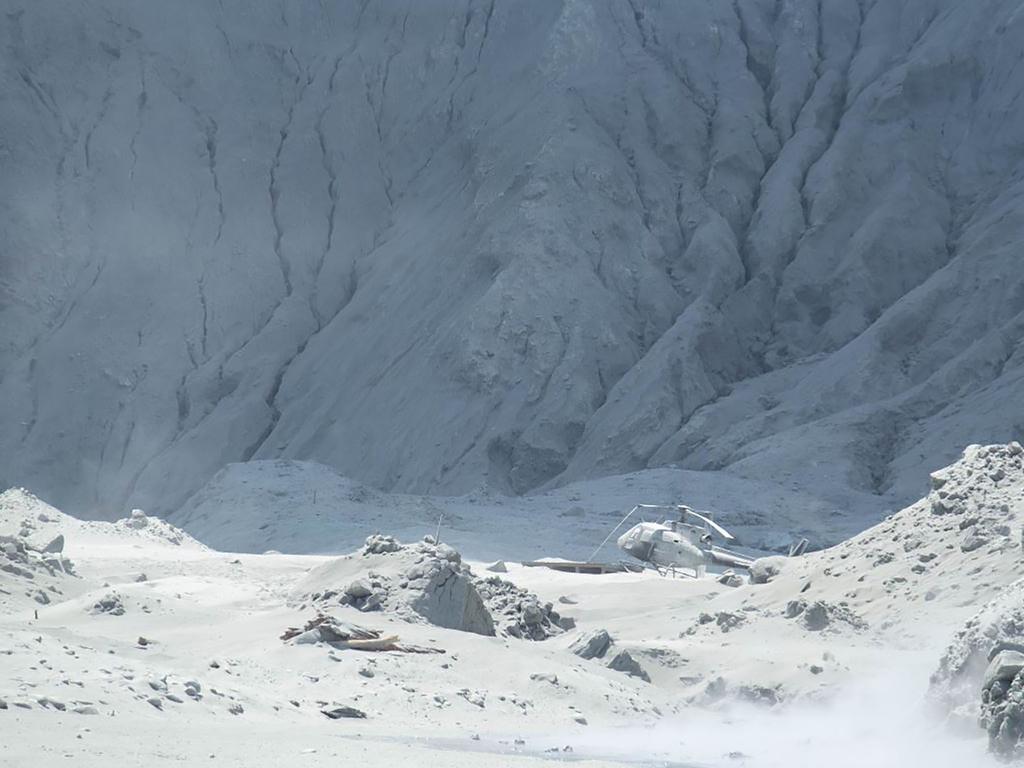 Tourist Michael Schade witnessed the explosion close up and took pictures of the wreckage of a helicopter amid ash. Picture: Michael Schade / AFP