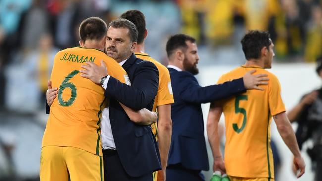 Ange Postecoglou hugs Matt Jruman.