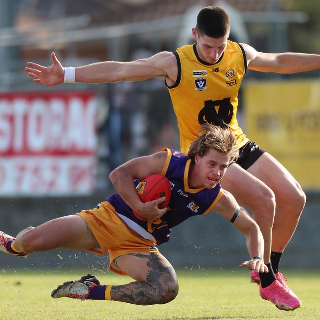 Goulburn Valley’s Matthew Lias slides in for a mark. Pictures Yuri Kouzmin