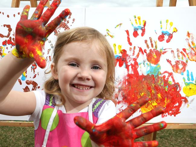 Flourish is a kids art festival and four year old Jasmin Collins cant wait to do some more handpainting at Broadwater Parklands. Picture Glenn Hampson