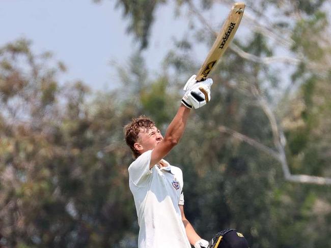 Lachie Russell raises the bat to the sky for Troy Selwood after his century. Picture: Michael Nelson/Geelong Grammar