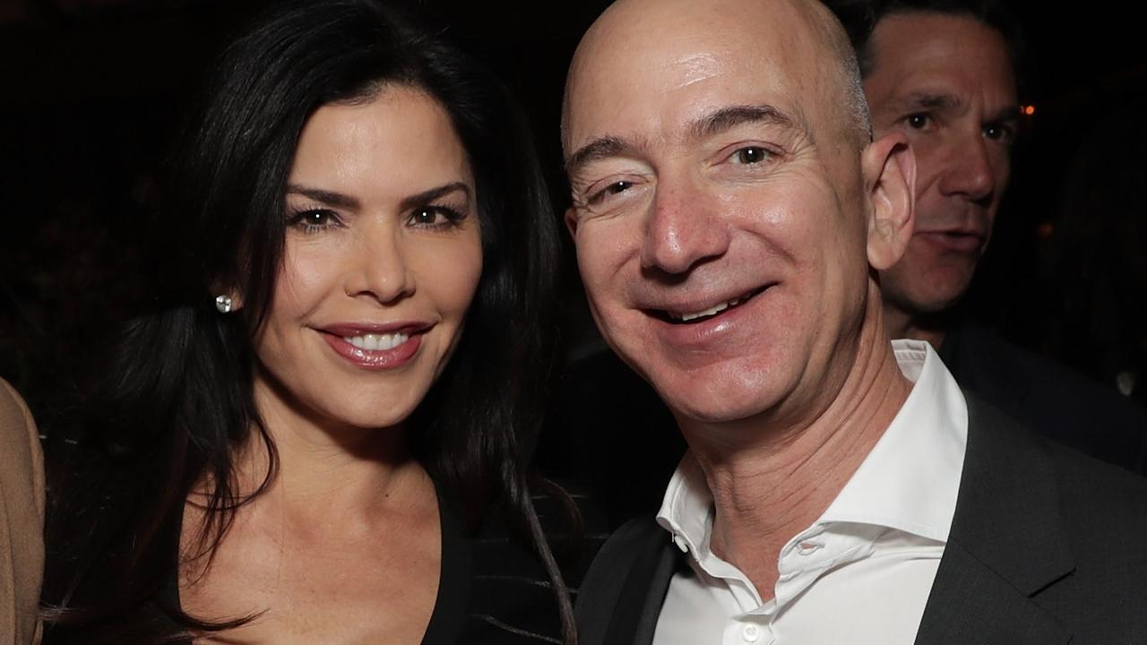 Jeff Bezos and Lauren Sanchez at a party together in 2016. Picture: Getty 