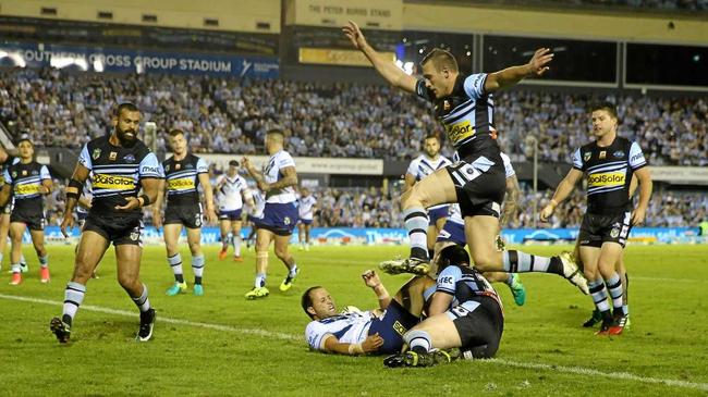 Tyrone Roberts of the Titans scores during the Round 8 NRL match between the Cronulla-Sutherland Sharks and the Gold Coast Titans at Southern Cross Group Stadium in Sydney, Saturday, April 22, 2017. (AAP Image/Craig Golding) NO ARCHIVING, EDITORIAL USE ONLY. Picture: CRAIG GOLDING/AAP