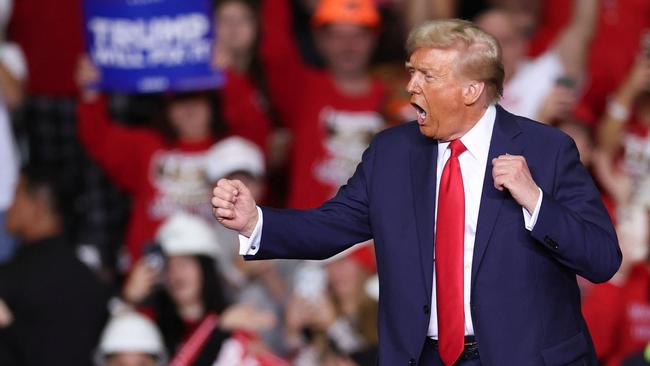 Former US President and Republican presidential candidate Donald Trump dances on stage after speaking at a campaign rally at PPG Paints Arena in Pittsburgh, Pennsylvania on November 4, 2024. Picture: CHARLY TRIBALLEAU / AFP