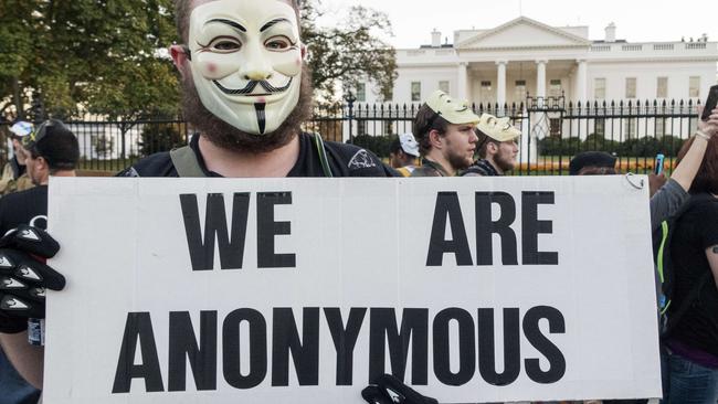 A protester wearing a Guy Fawkes mask stands near the White House during the Anonymous Million Mask March earlier this month. Picture: Paul J Richards / AFP