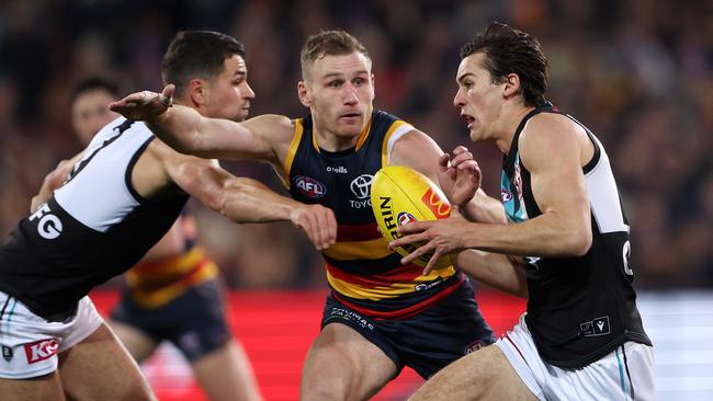 Port Adelaide star Connor Rozee gets away from Crow Rory Laird. Picture: Sarah Reed/AFL Photos