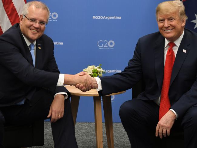 US President Donald Trump and Australia's Prime Minister Scott Morrison shake hands during a meeting in the sidelines of the G20 Leaders' Summit in Buenos Aires, on November 30, 2018. - Global leaders gather in the Argentine capital for a two-day G20 summit beginning on Friday likely to be dominated by simmering international tensions over trade. (Photo by SAUL LOEB / AFP)