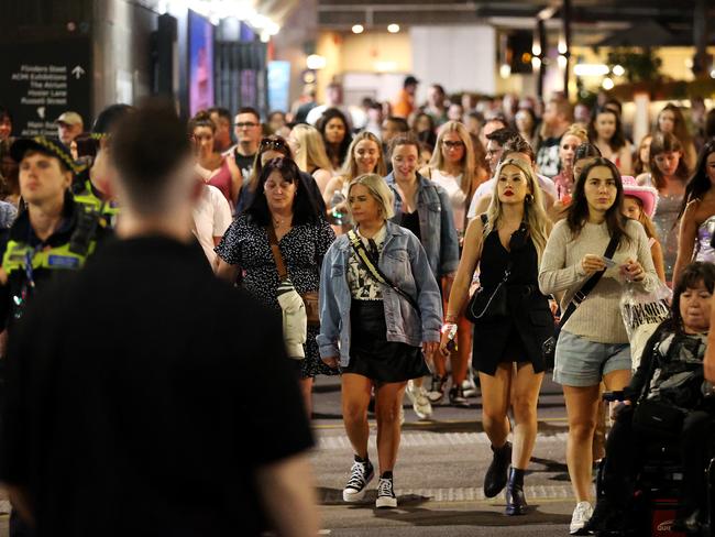 MELBOURNE, FEBRUARY 16, 2024: Taylor Swift fans outside Flinders Street Station after the first Melbourne concert during her Eras Tour. Picture: Mark Stewart