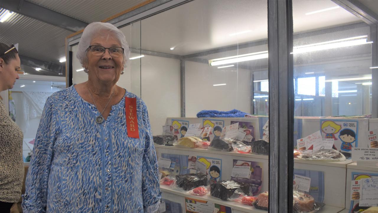 Show steward Shirley Baldwin with the display of cakes in the youth special needs category.