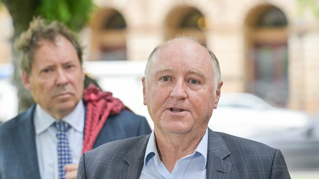 Former Renewal SA boss John Hanlon, right, outside the District Court with his barrister David Edwardson KC after the DPP withdrew all charges against him. Picture: NCA NewsWire / Brenton Edwards