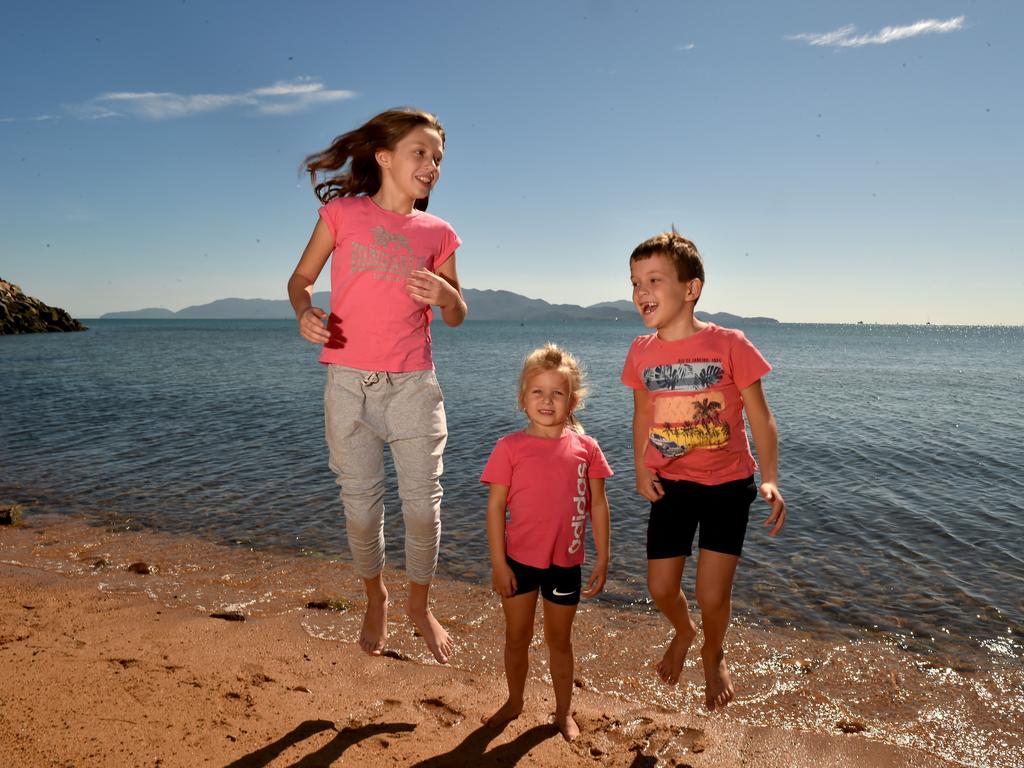 Townsville residents relaxing on the Strand after the relaxation of COVID-19 restrictions. Ameliah Malkus, 10, Maddie Moore, 4, and Koen Malkus, 7, from Alice River. Picture: Evan Morgan