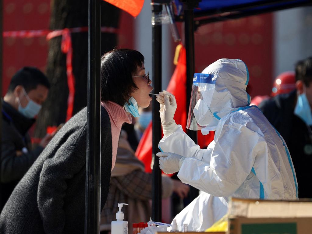 A medical worker taking a sample from a resident to be tested for Covid-19 in Xi'an, in China's northern Shaanxi province. Picture: AFP / China OUT