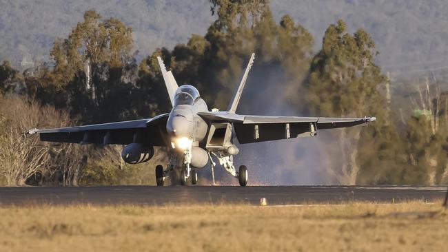 A F/A-18F Super Hornet takes off at RAAF Amberley in Queensland, one of four bases which will receive upgrades under a Coalition plan. Picture: AFP/Royal Australian Air Force