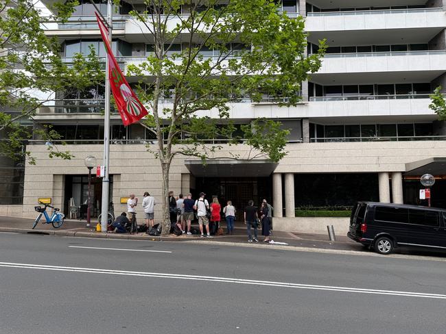 Several crews of news media are pictured outside the prestigious apartment complex where Alan Jones has been arrested in his penthouse apartment for alleged historical crimes. Picture: NewsWire / Gaye Gerard