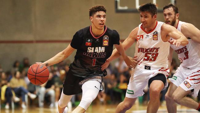 LaMelo Ball dribbles past Damian Martin of the Perth Wildcats. Picture: NIKKI DAVIS-JONES