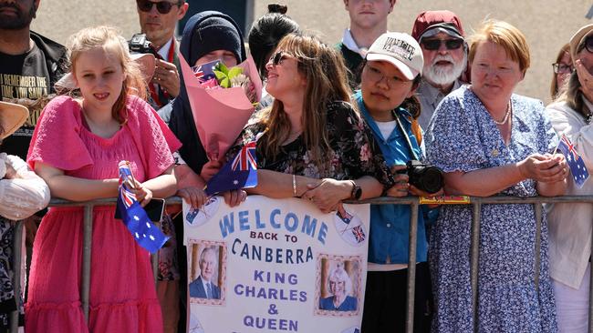 People wait to see Britain’s King Charles III and Queen Camilla outside Parliament House in Canberra. Picture: David GRAY / POOL / AFP