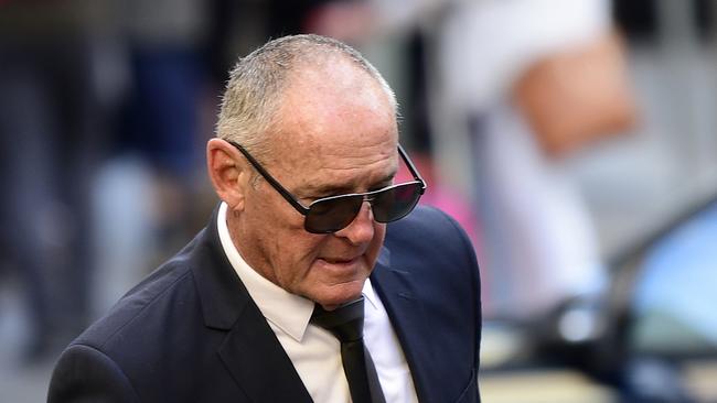 Chis Dawson arrives at Downing Centre Local Court in Sydney, Thursday, June 20, 2019. Dawson, who was extradited from Queensland, is accused of murdering his wife Lynette in 1982. (AAP Image/Dean Lewins) NO ARCHIVING