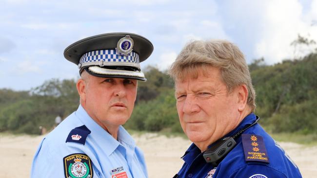 Police chief inspector Matt Kehoe and NSW Ambulance paramedic duty officer Terry Savage at the scene of the fatal shark attack. Picture: Scott Powick