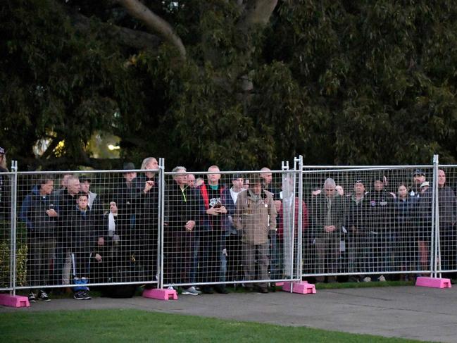 People watch from behind fences at the Anzac Day dawn service at the Shrine of Remembrance in Melbourne. Picture: AFP