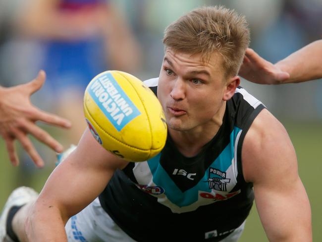 MELBOURNE, AUSTRALIA - JULY 29:  Ollie Wines of the Power handballs during the round 19 AFL match between the Western Bulldogs and the Port Adelaide Power at Mars Stadium on July 29, 2018 in Melbourne, Australia.  (Photo by Darrian Traynor/Getty Images)