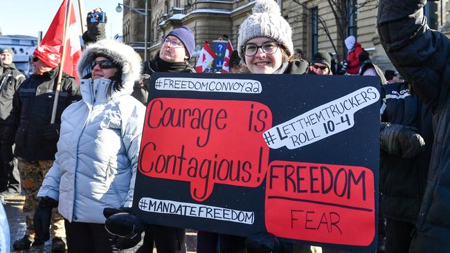 A freedom supporter holds a sign backing the truckers convoy in Ottawa, Canada. Picture: Minas Panagiotakis/Getty Images/AFP