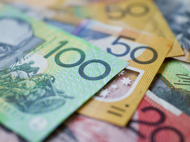 Australian money background showing $100, $50 and $20 notes with a shallow depth of field.