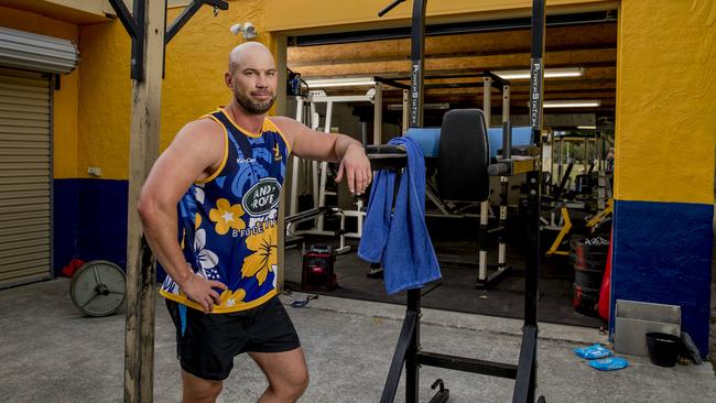 Gold Coast Eagles rugby club have found a loophole in COVID-19 restrictions to get a leg up on competition. They've taken their club gym outside and set up a roster to keep them fit + monitor mental health. Aaron Grant in the outside gym. Picture: Jerad Williams