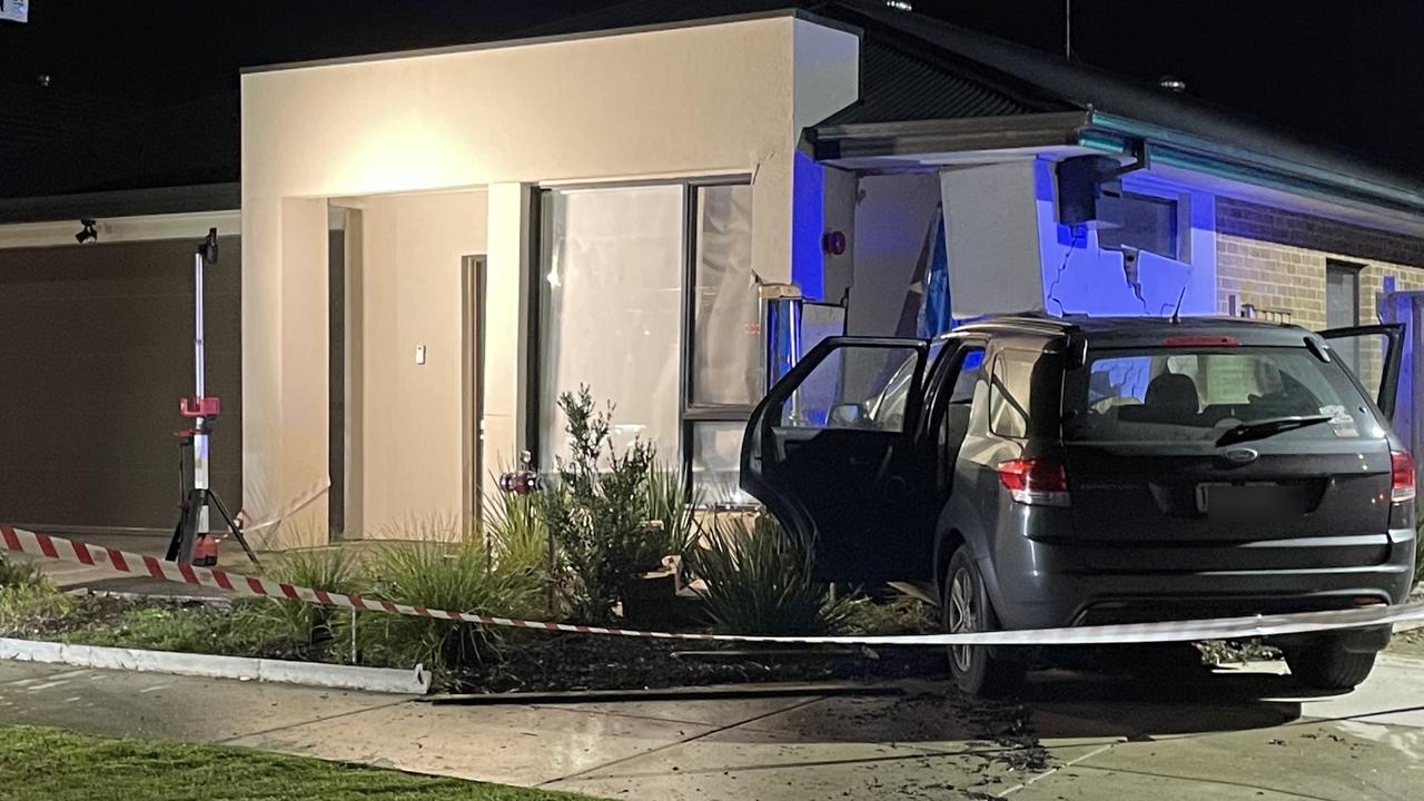 Man arrested after car slams into Geelong home
