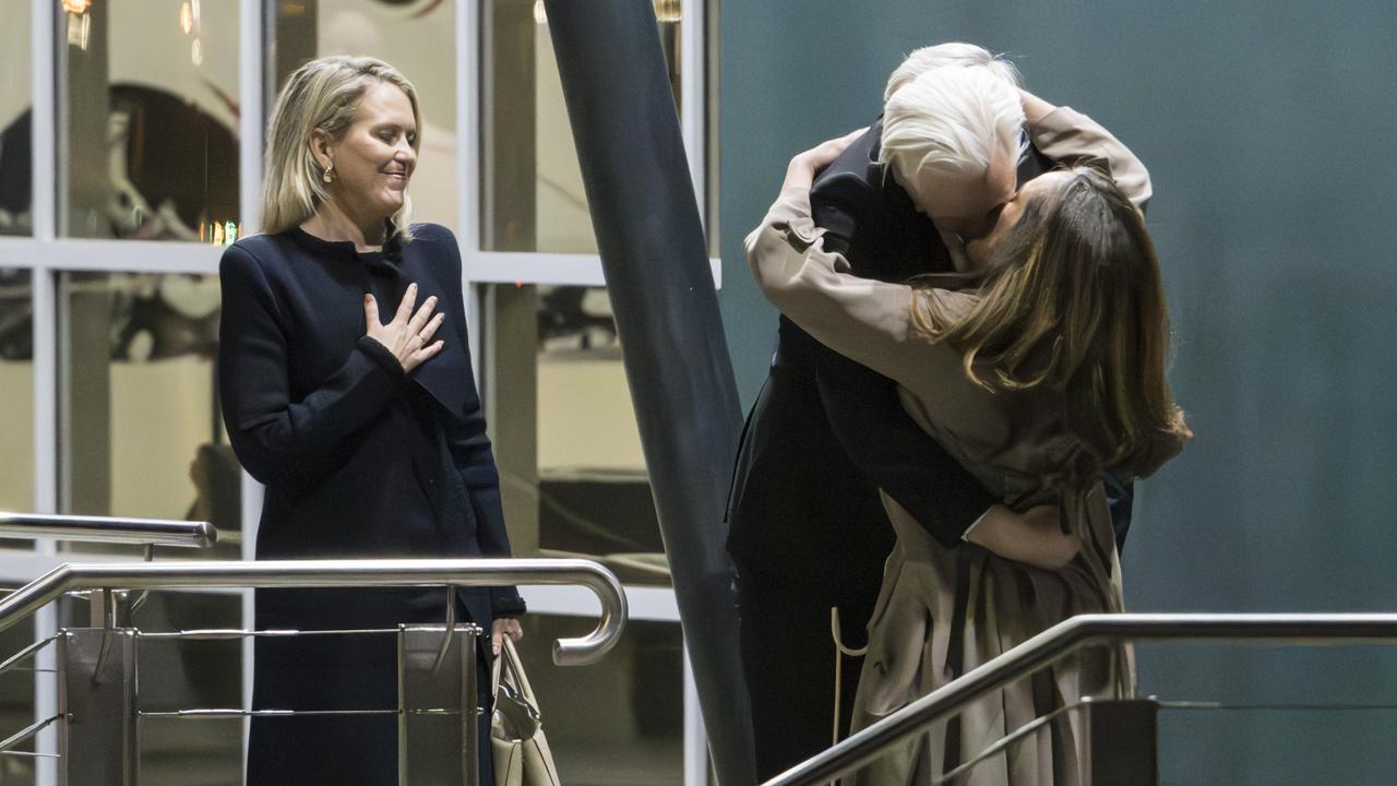 Mr Assange’s lawyer Jennifer Robinson looks on as he hugs his wife Stella after touching down in Australia on Wednesday night. Picture: NewsWire/ Martin Ollman