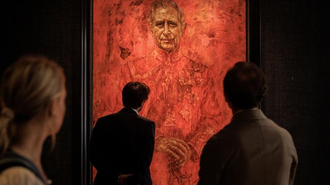 Members of the public view the newly installed painting of King Charles at The Philip Mould Gallery in London.