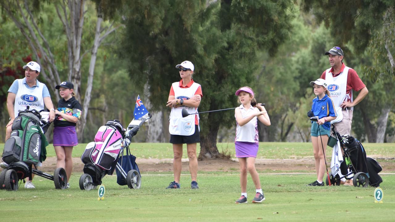 Players and caddies on course on the second day of the US Kids Golf Foundation Australian Open at the Rockhampton Golf Club.