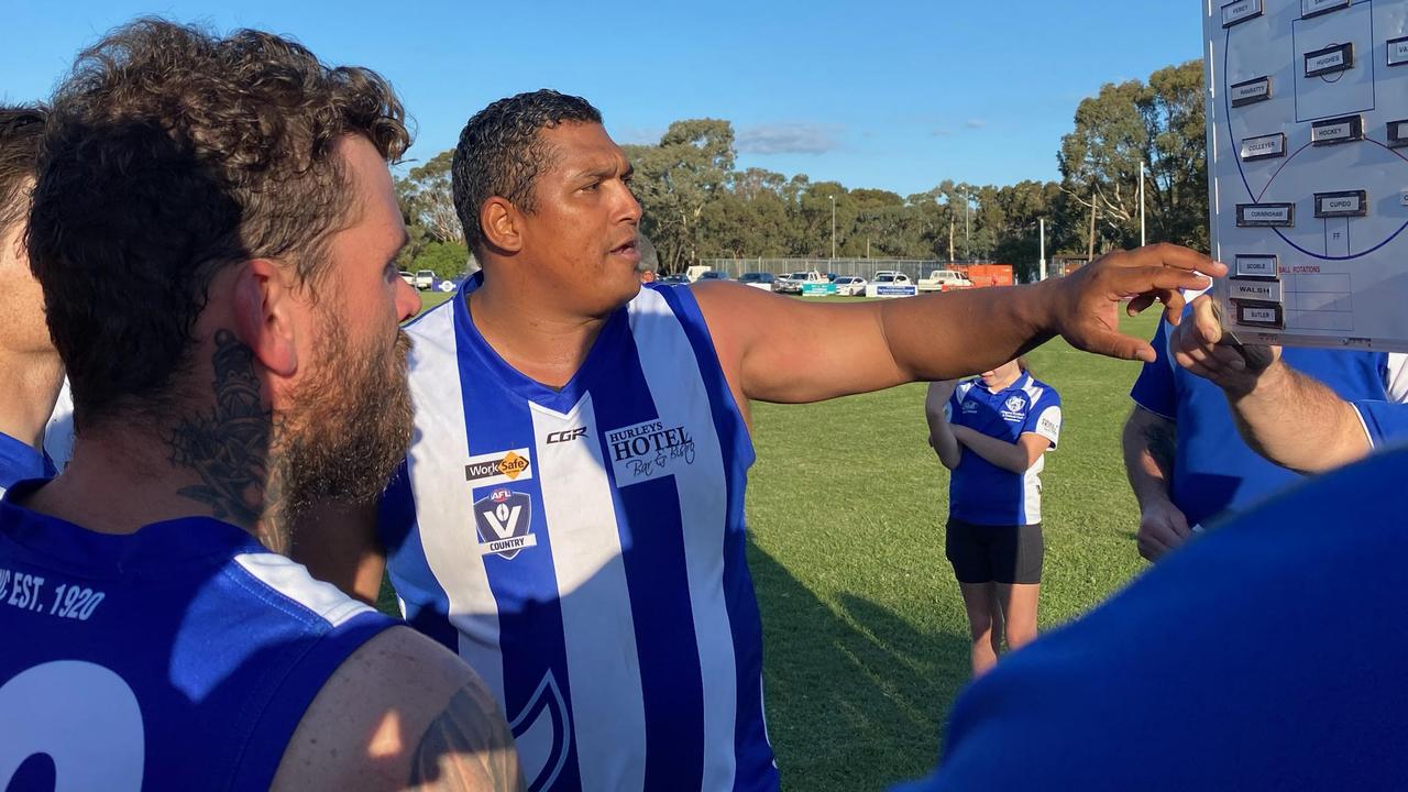 Damian Cupido talks tactics with his Girgarre Kangaroos teammates during their big win over Longwood at home. Picture: Paul Amy
