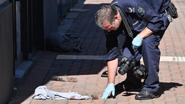 Forensic police collect hair after a large brawl on a bus in George St, Thebarton. Picture: Brenton Edwards