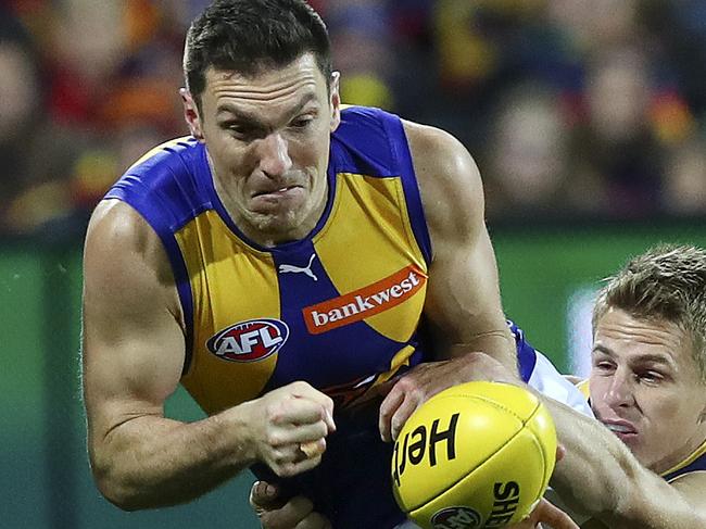 AFL - Adelaide Crows v West Coast Eagles at Adelaide Oval. Sam Butler under pressure from David McKay. Picture Sarah Reed