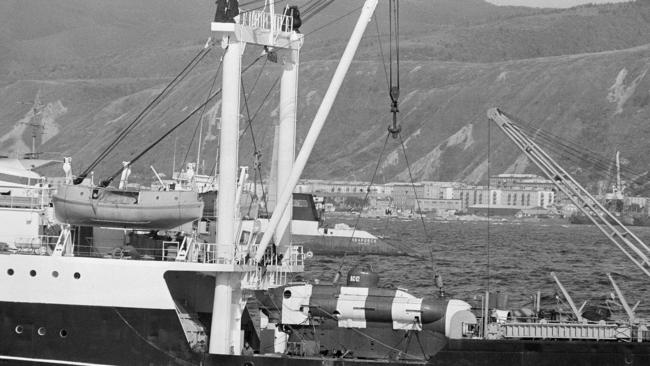 1983: A Soviet mini-submarine used in the search for debris from Korean Air Lines flight 007 rests on the deck of a conventional tender vessel in Nevel'sk, Sakhalin Island, in the East Sea off Russia. Picture: Ap