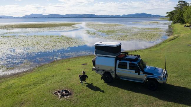 A relaxed Sean Scott sits on the banks of Kinchant Dam, one of the many camping and caravan spots of the Mackay region. Photo: Mackay Tourism.